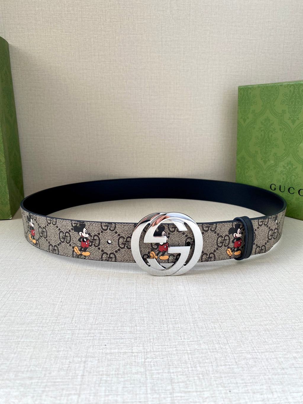 Gucci belt, navy GG monogram with Mickey print; silver interlocking G buckle
