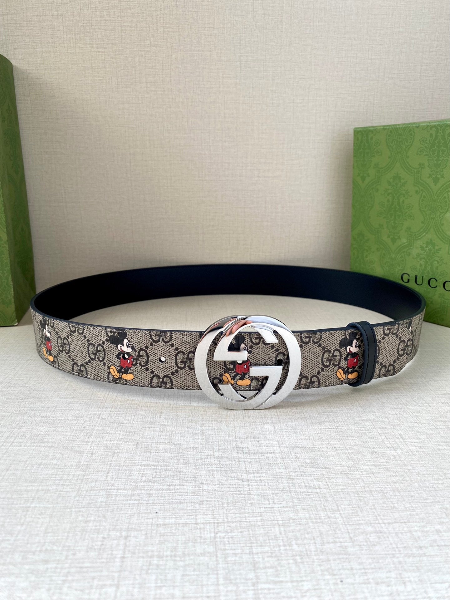 Gucci belt, navy GG monogram with Mickey print; silver interlocking G buckle