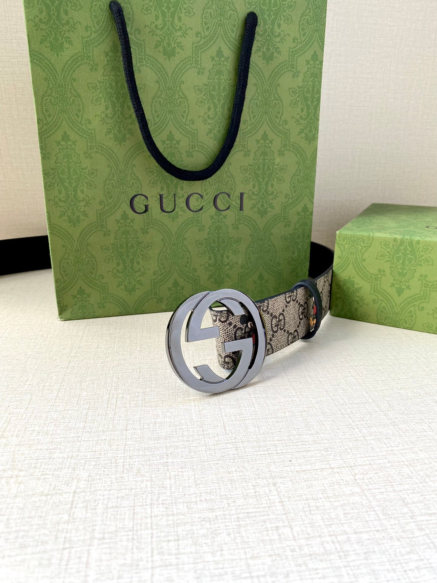 Gucci belt with navy GG monogram Mickey print; silver interlocking G buckle