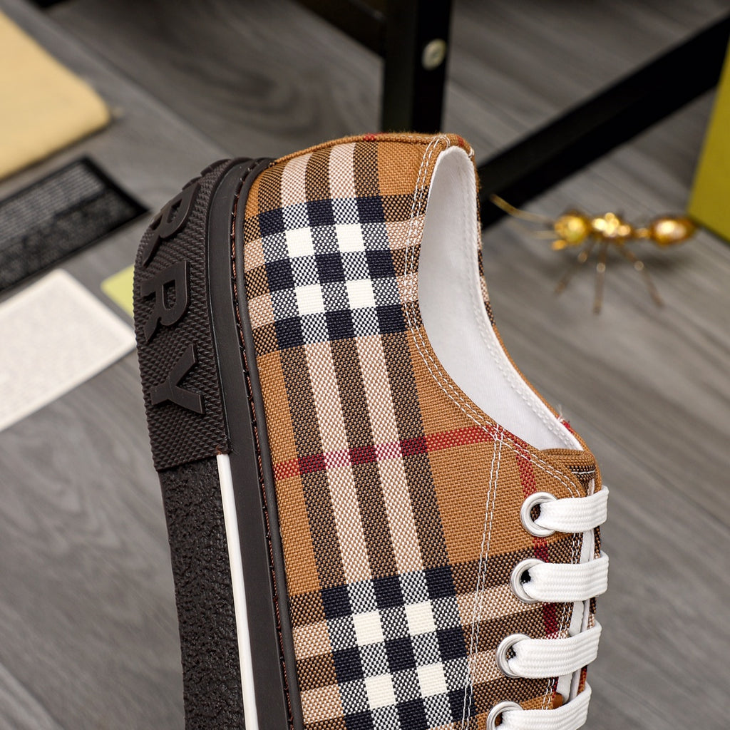 Burberry low-top sneaker side view with check fabric panels and white lace-up