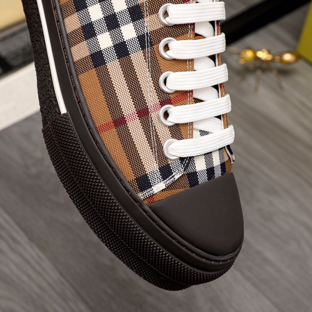 Burberry check-print sneaker close-up with white laces and dark rubber edging