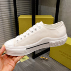 Burberry white low-top sneakers with lace-up front and rubber cupsole