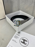 Chanel belt in light gray leather with blue-and-gold logo buckle, flat view