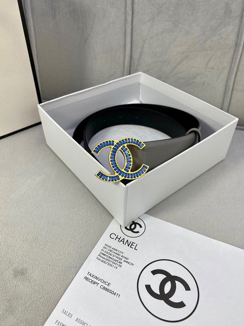 Chanel belt in light gray leather with blue-and-gold logo buckle, flat view