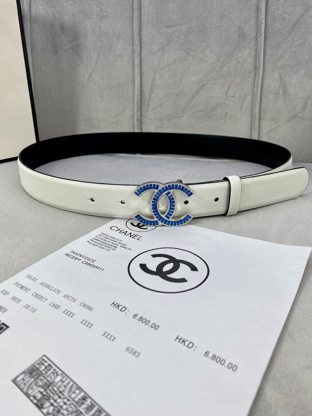White leather belt with CHANEL logo buckle in gold and blue enamel