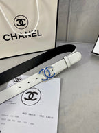 White leather belt with gold-and-blue CHANEL buckle on a product box