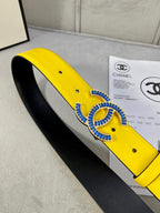 Chanel belt side view, yellow leather strap with blue CC buckle and black interior