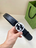 Navy leather belt with silver-toned circular GG logo buckle