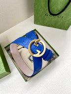 Gucci belt blue leather with gold-tone interlocking GG buckle and pale pink lining.