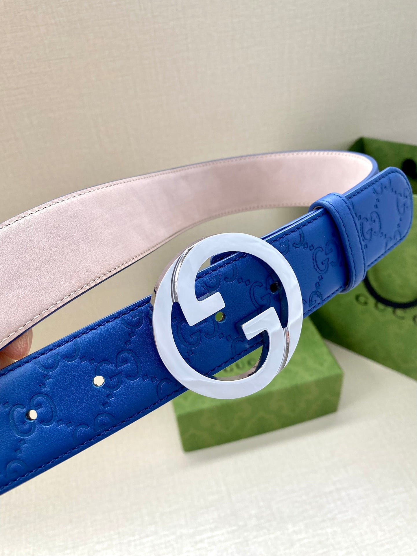 Gucci belt blue leather with silver interlocking GG buckle and pale pink lining.