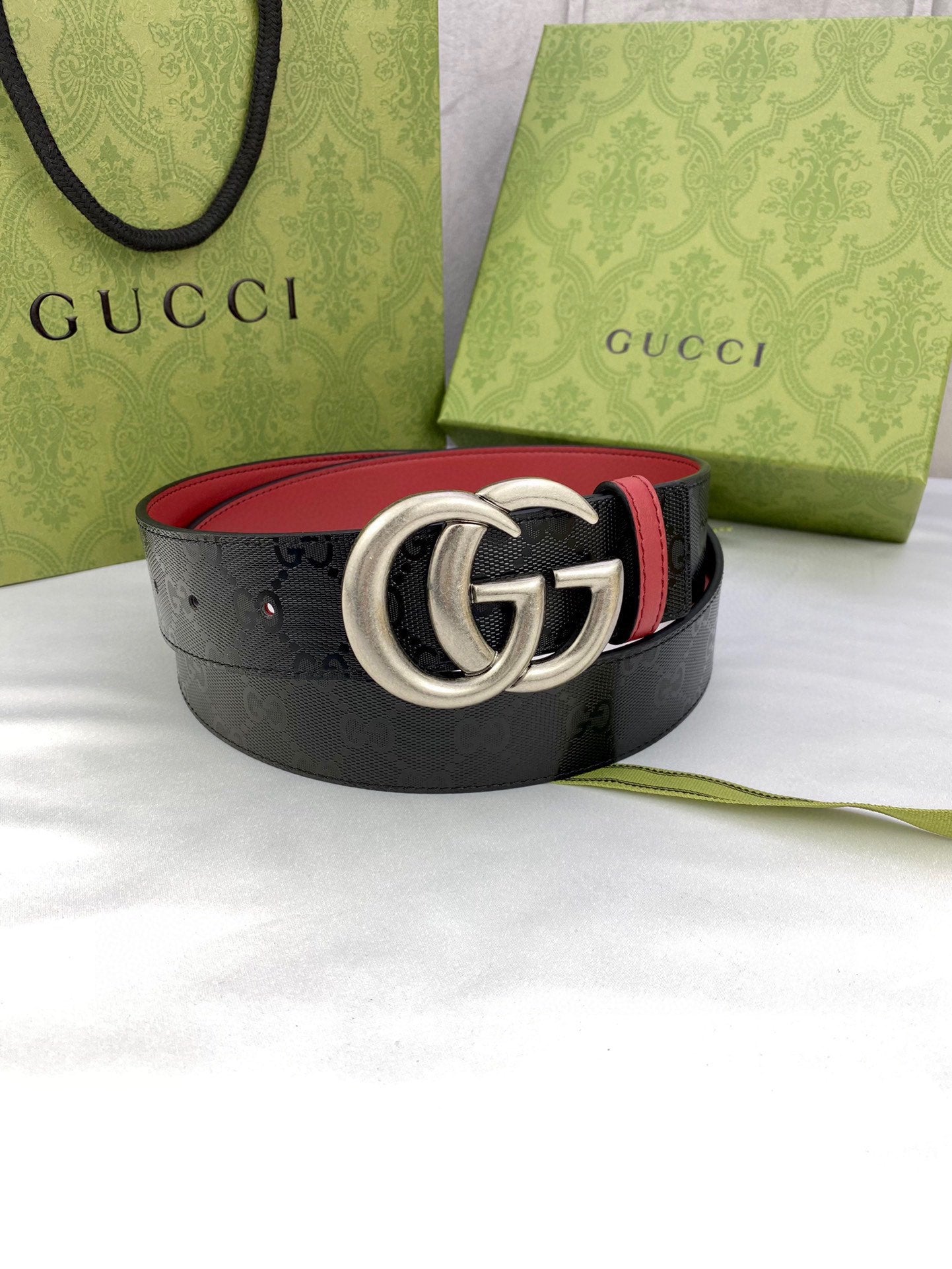 Gucci belt, black patterned strap with red inner edge and silver-tone double G buckle