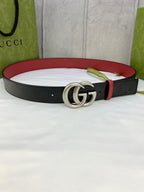 Gucci belt with black monogram leather and silver-tone double G buckle, red lining