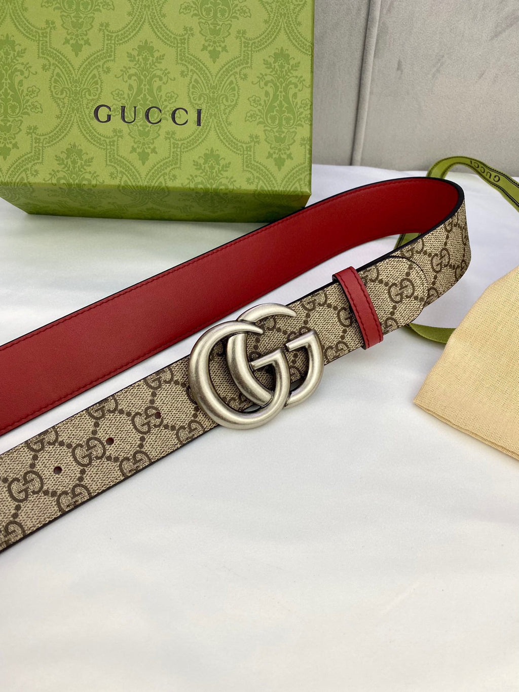 Gucci belt with GG monogram strap, red leather edge, silver double-G buckle detail