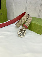 Gucci belt laid flat, GG monogram canvas with red leather sides and silver double-G buckle