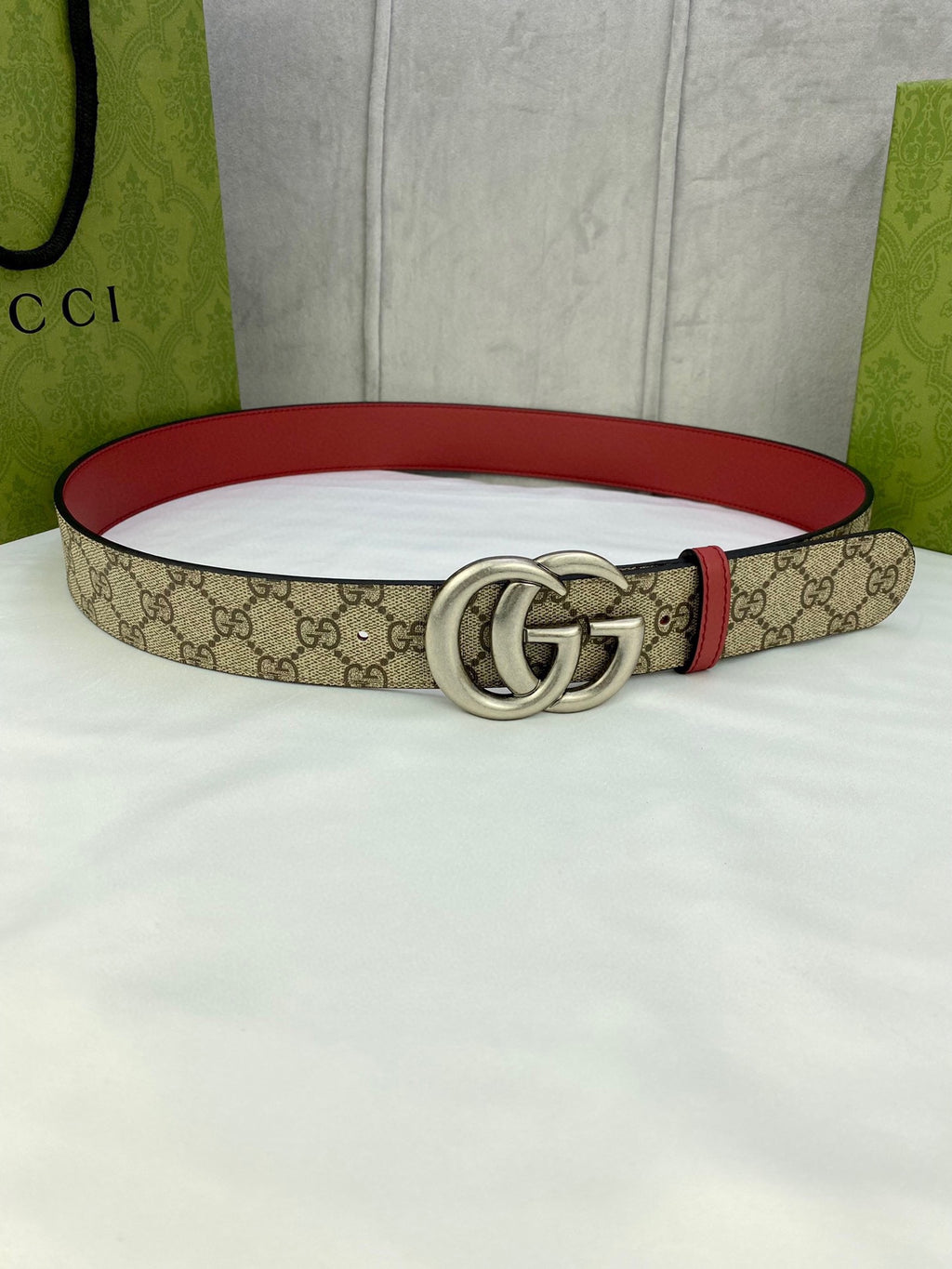 Gucci belt with GG monogram canvas, red leather trim, silver double-G buckle