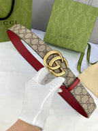 Gucci belt with GG monogram canvas and red leather edges, gold-toned double-G buckle