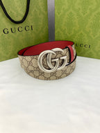 Gucci belt with GG canvas and red lining, silver double-G buckle, curved strap