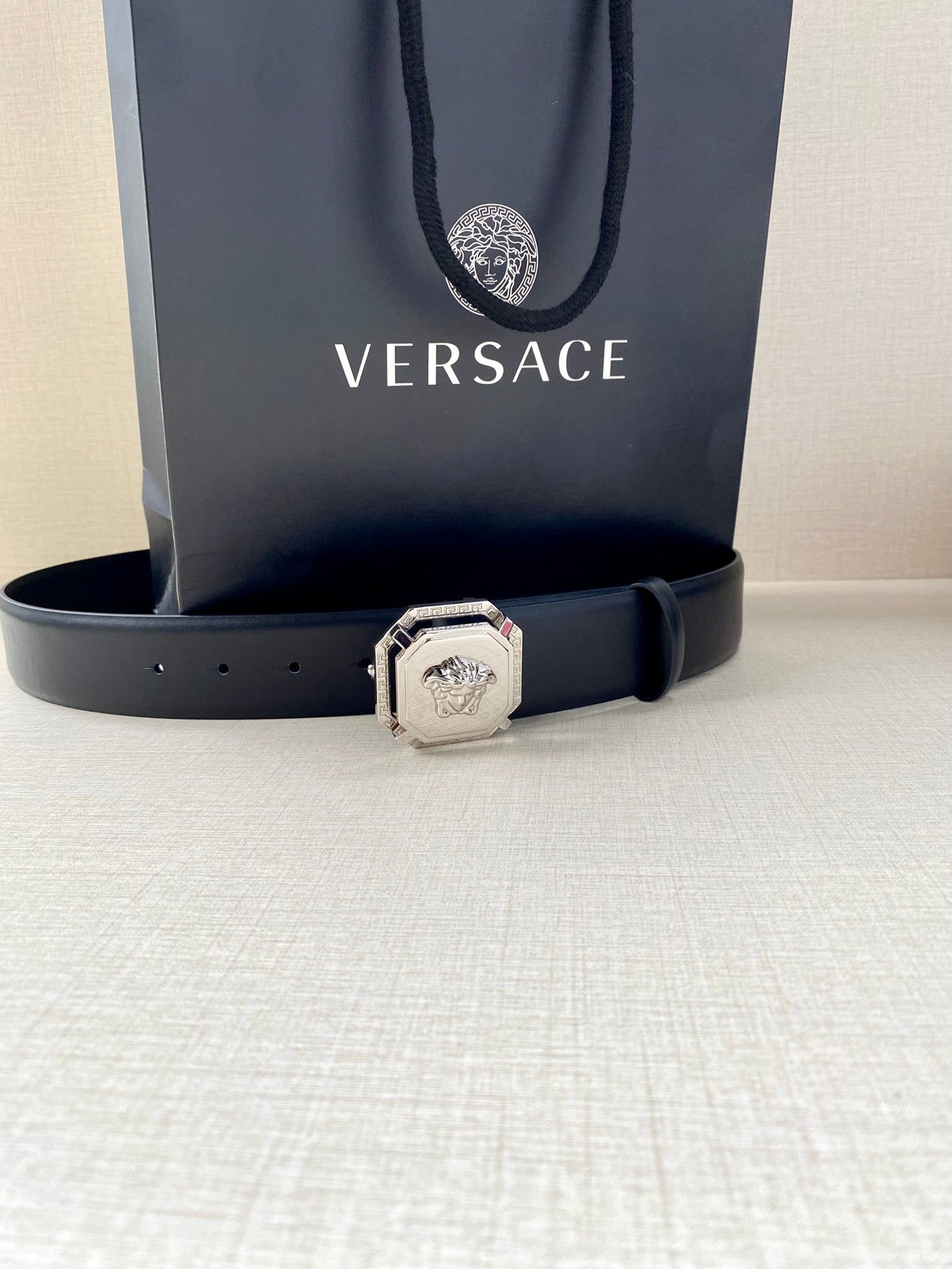 Versace leather belt, dark blue with silver-toned logo buckle and punched holes