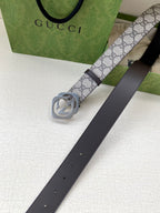 Gucci belt with GG canvas strap, silver interlocking G buckle, dark leather holes