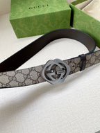 Gucci belt in GG canvas with dark leather edge and silver buckle detail