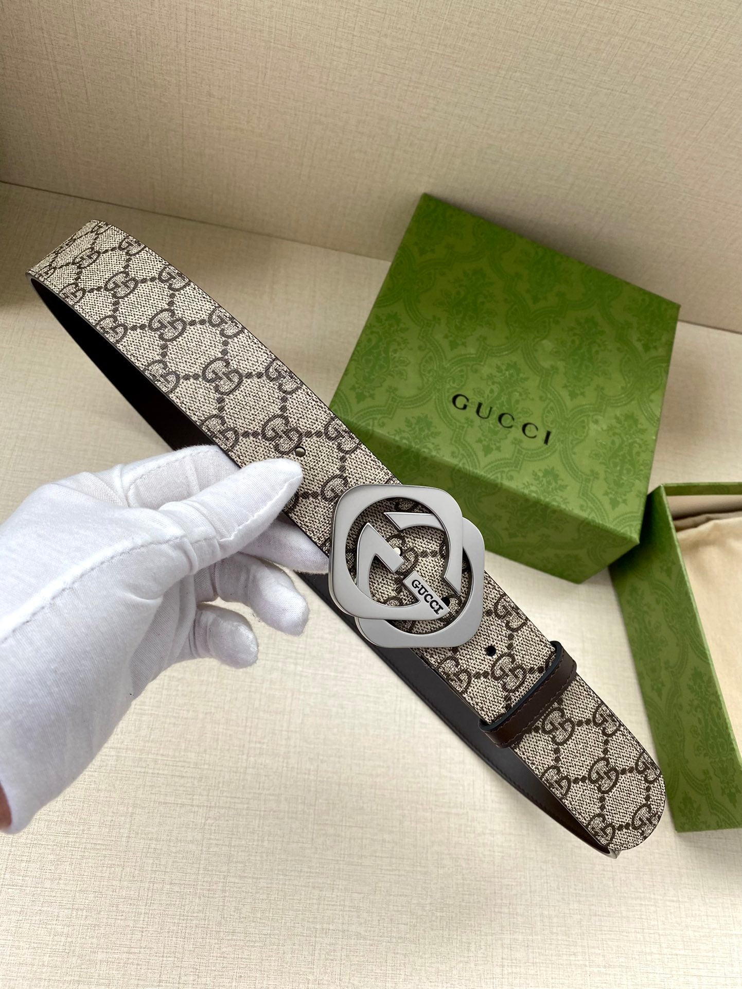Gucci belt with GG logo canvas strap and silver interlocking G buckle