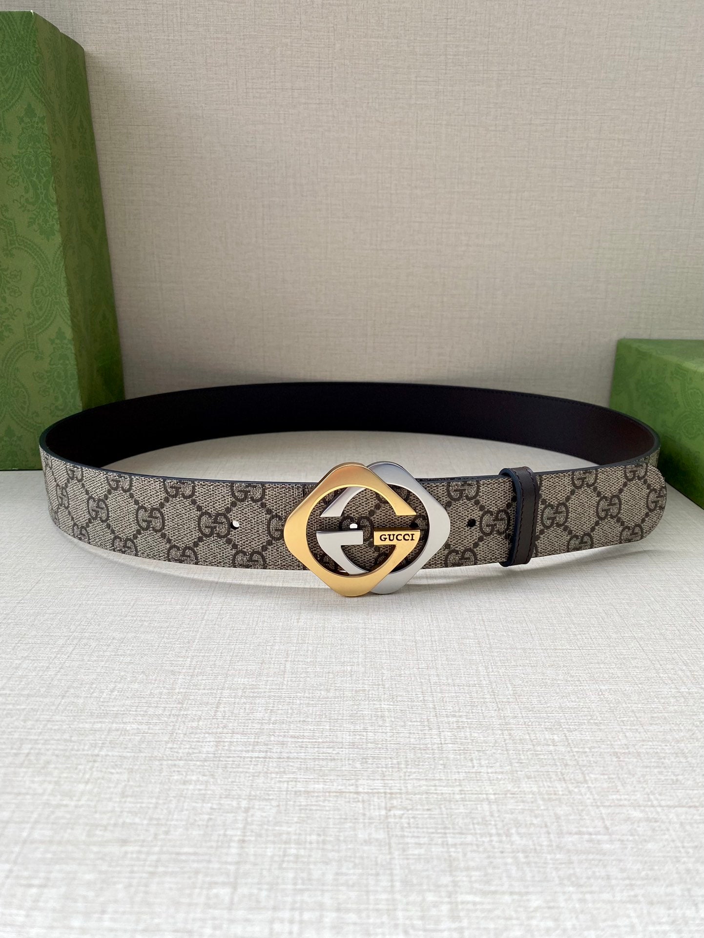 GG monogram belt with dark brown leather strap and gold-toned buckle, front view