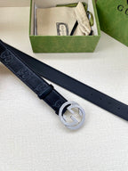 Gucci belt in dark navy with silver interlocking G buckle, belt laid out