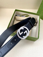 Gucci belt in dark navy with silver interlocking G buckle, shown in gift box