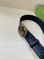Dark navy belt with round Interlocking G buckle on embossed leather strap