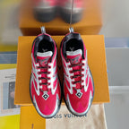 Two Louis Vuitton unisex sneakers front view, pink uppers with silver logos and lace-up