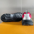 Louis Vuitton unisex sneakers from heel and outsole view, pink with black tread sole