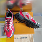 Louis Vuitton unisex sneakers with pink uppers and silver trim on black rugged sole