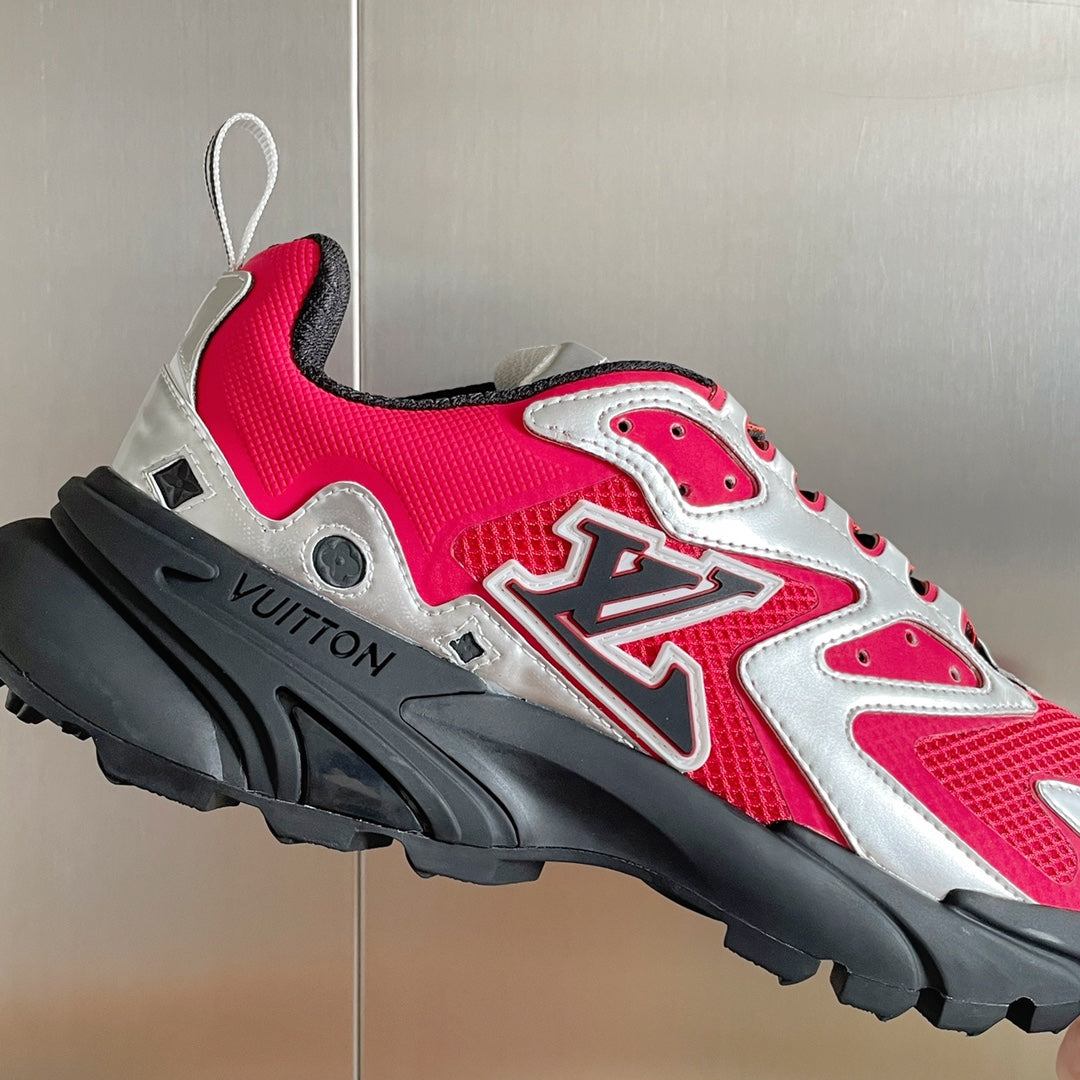 Louis Vuitton unisex sneaker in pink with silver detailing and black sculpted sole