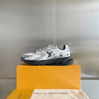 Louis Vuitton unisex sneakers on box lid, white uppers with black rubber outsole