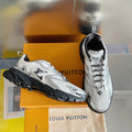 Unisex white-and-gray Louis Vuitton sneakers with black rubber sole, lace-up style