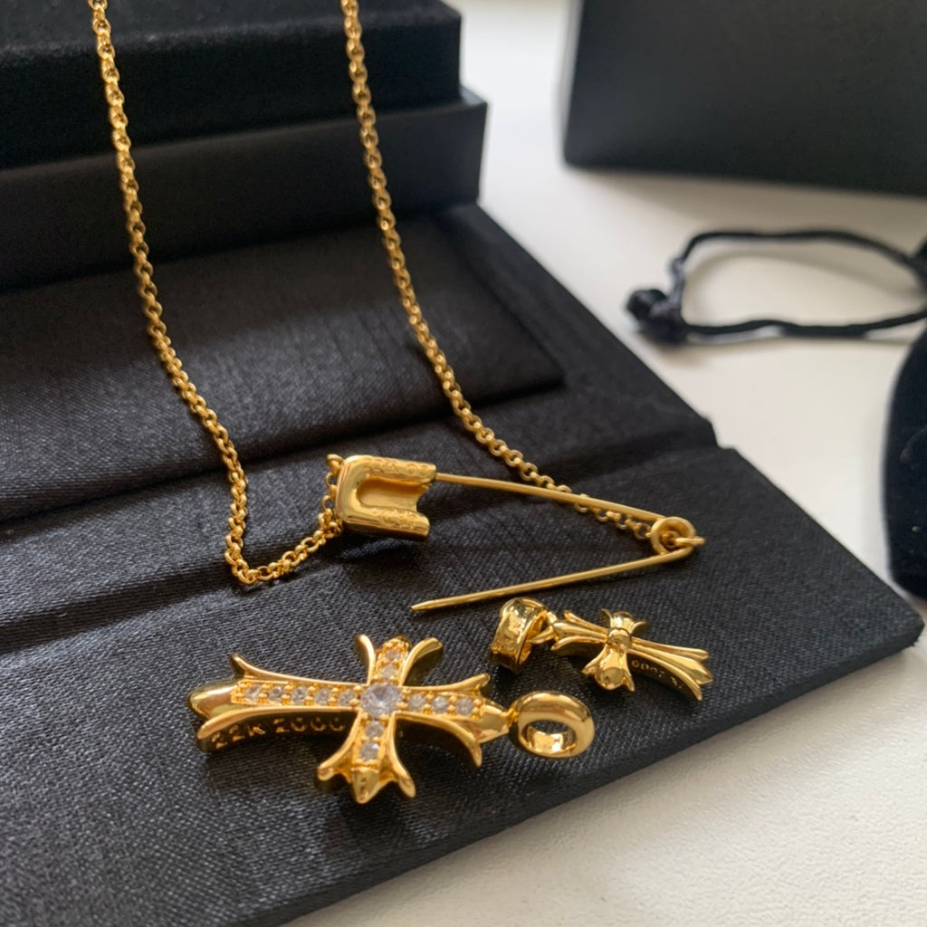 Gold cross pendant necklace with matching hoop earring pair and chain
