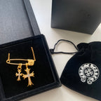 Gold cross pendant necklace with chain, shown with gift box and pouch