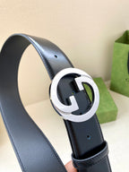 Gucci belt, dark blue leather belt with silver-tone G buckle close-up
