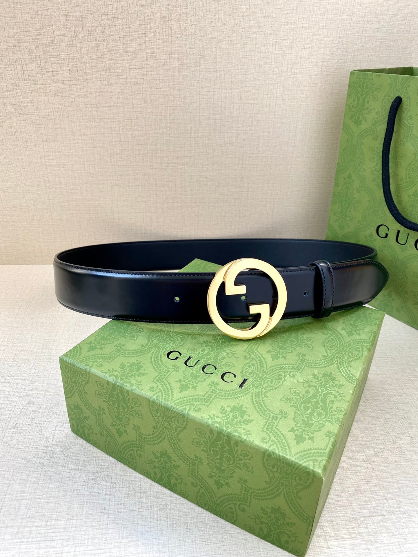 Gucci belt, dark blue leather strap with gold-tone G buckle