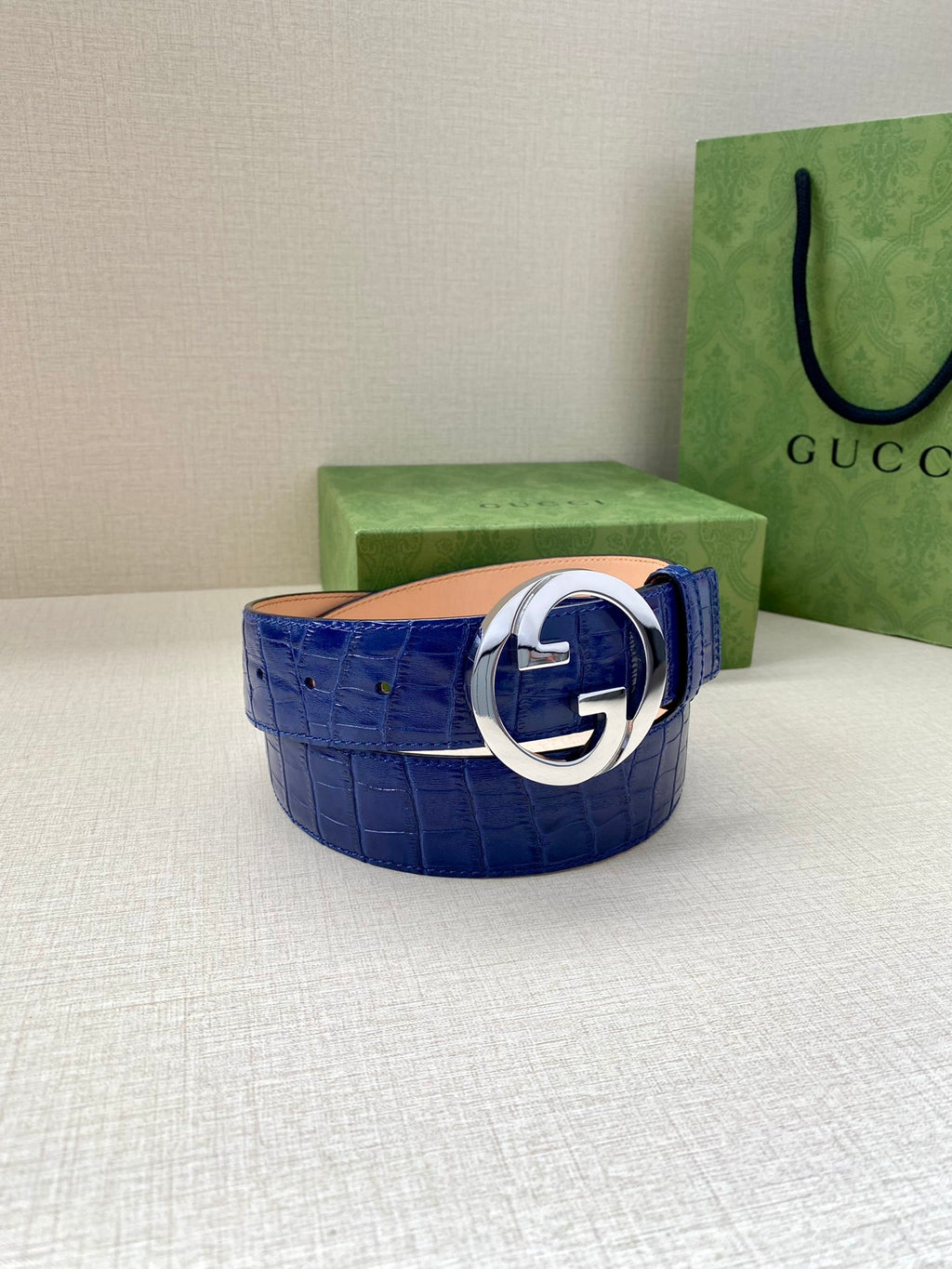 Blue croc-embossed Gucci belt with silver-tone GG buckle