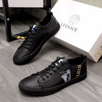 Versace black lace-up low-top sneakers with gold logo and side emblem detail