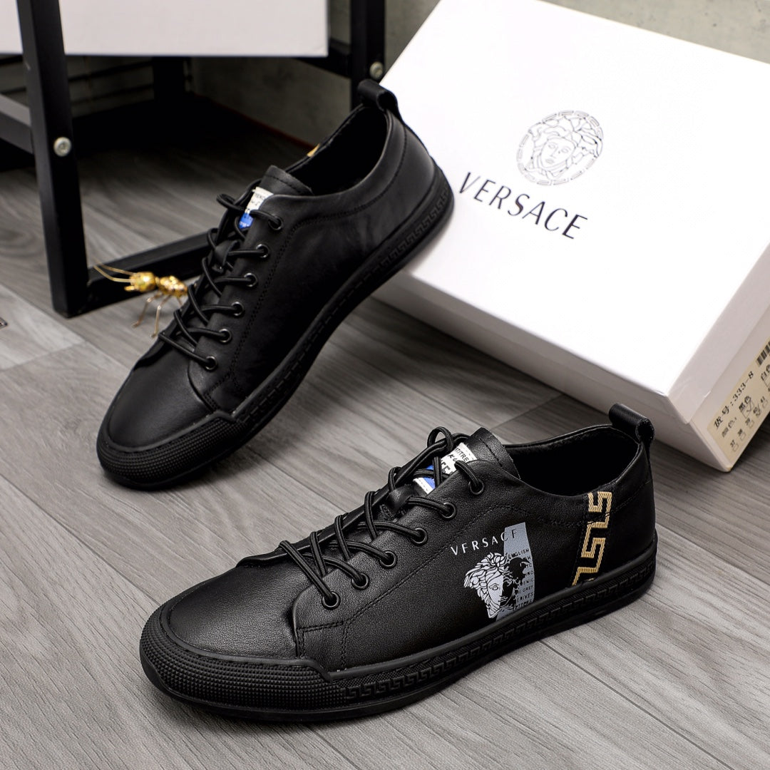 Versace black lace-up low-top sneakers with gold logo and side emblem detail