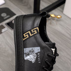 Versace black lace-up sneakers with gold logo stripe and printed side crest