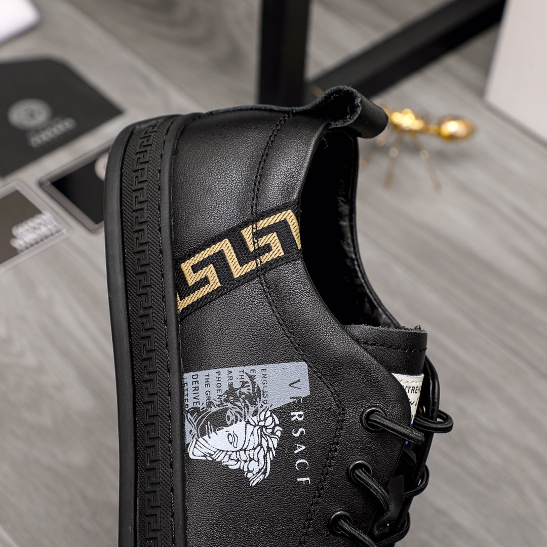 Versace black lace-up sneakers with gold logo stripe and printed side crest