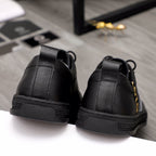 Versace black low-top sneakers with rear pull tab and textured side sole
