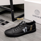 Versace black lace-up low-top sneakers with gold side emblem and small crest patch