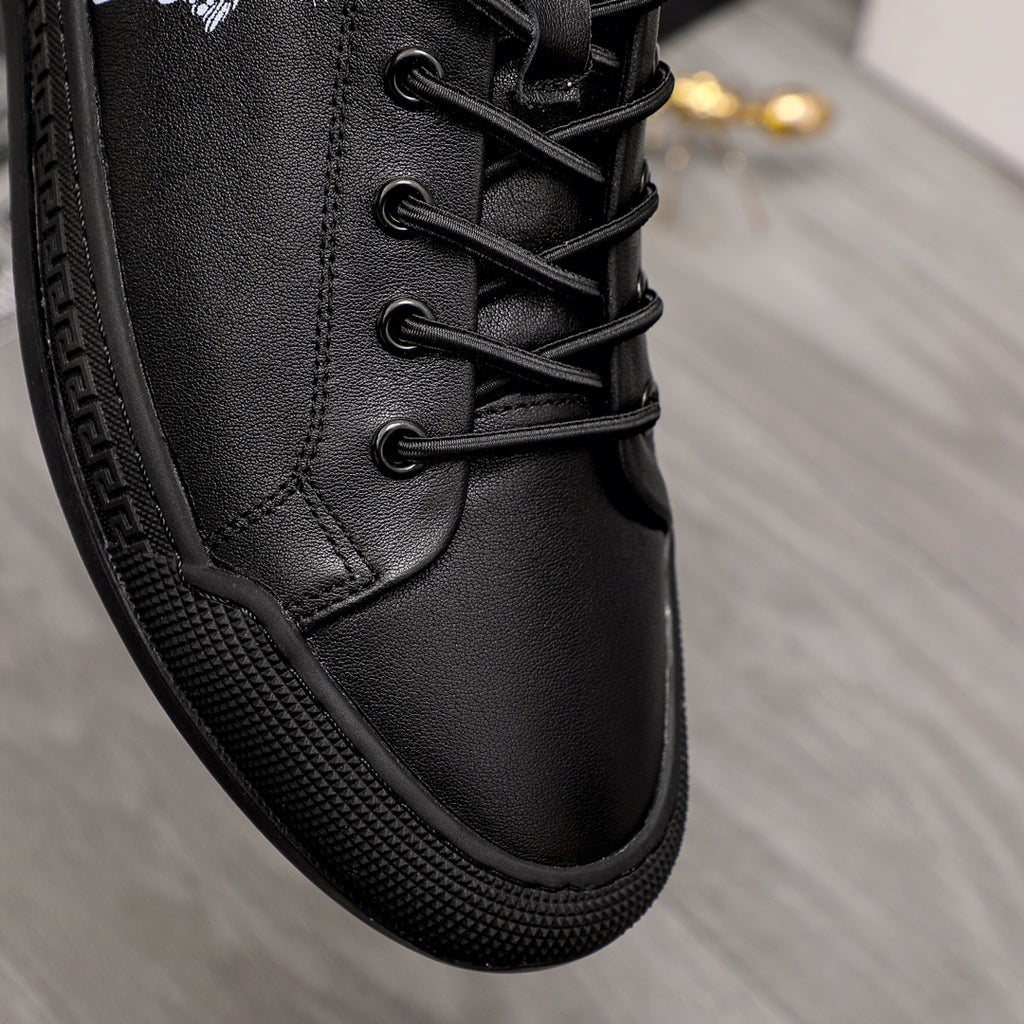 Versace black lace-up sneakers close-up of textured sole and stitched upper