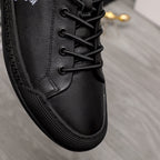 Versace black lace-up sneakers close-up of textured sole and stitched upper