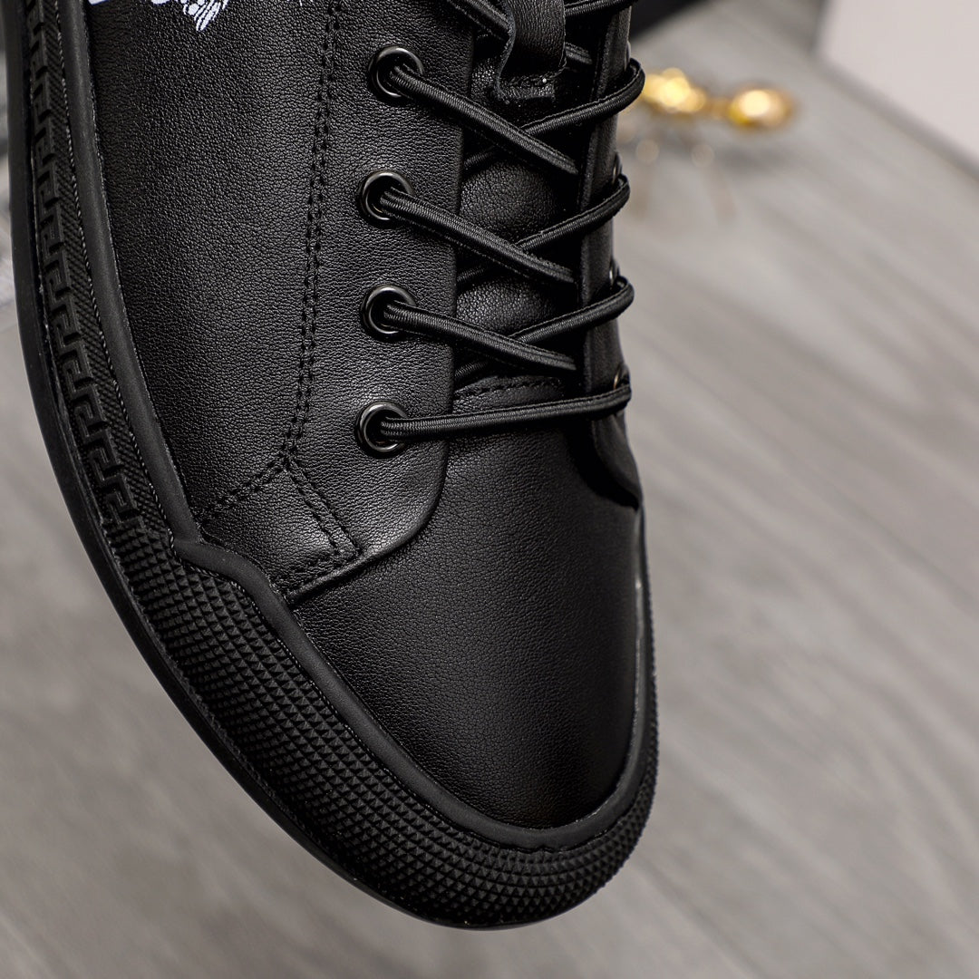 Versace black lace-up sneakers close-up of textured sole and stitched upper