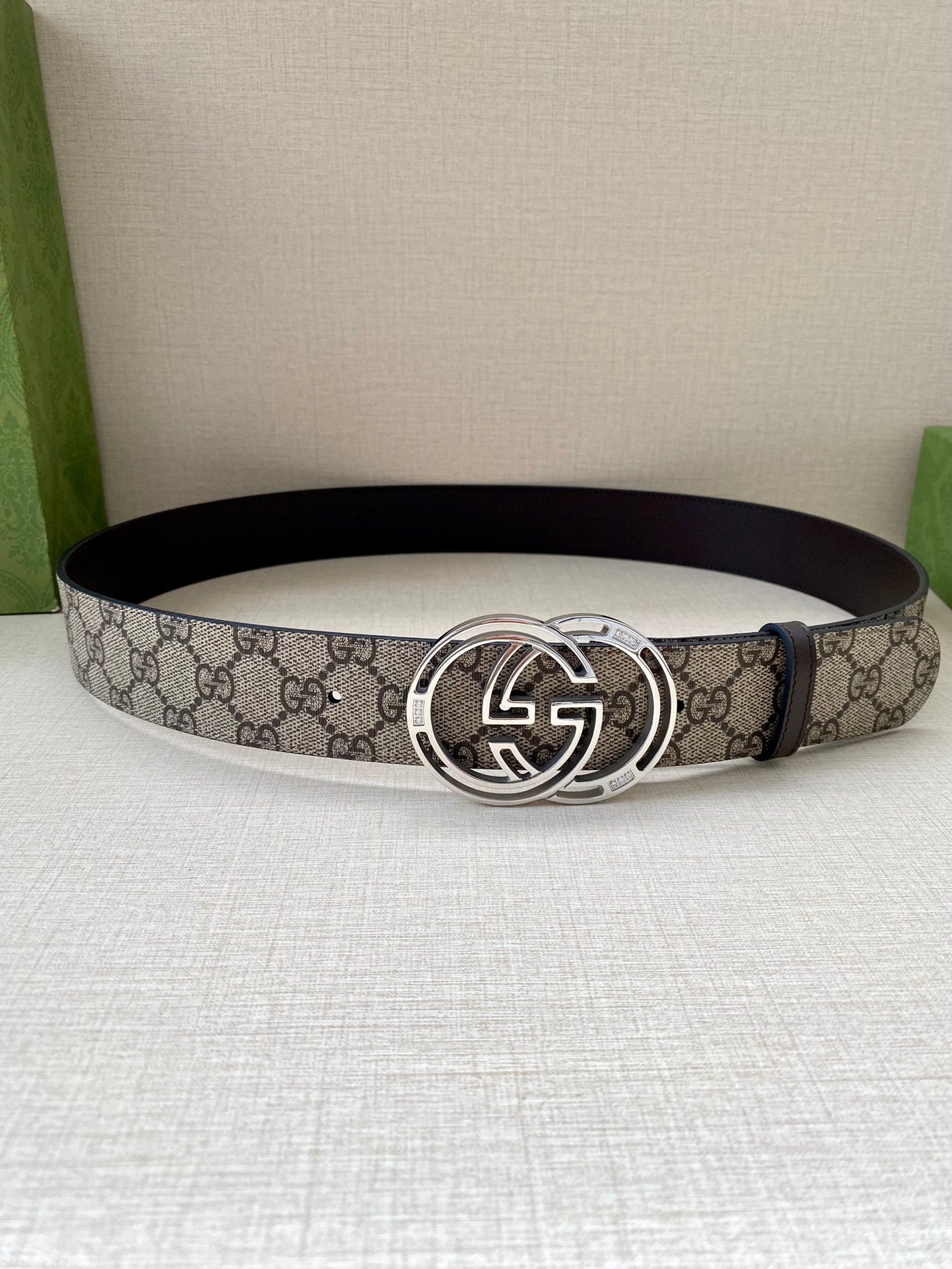 Gucci belt with GG canvas strap and silver-tone interlocking G buckle